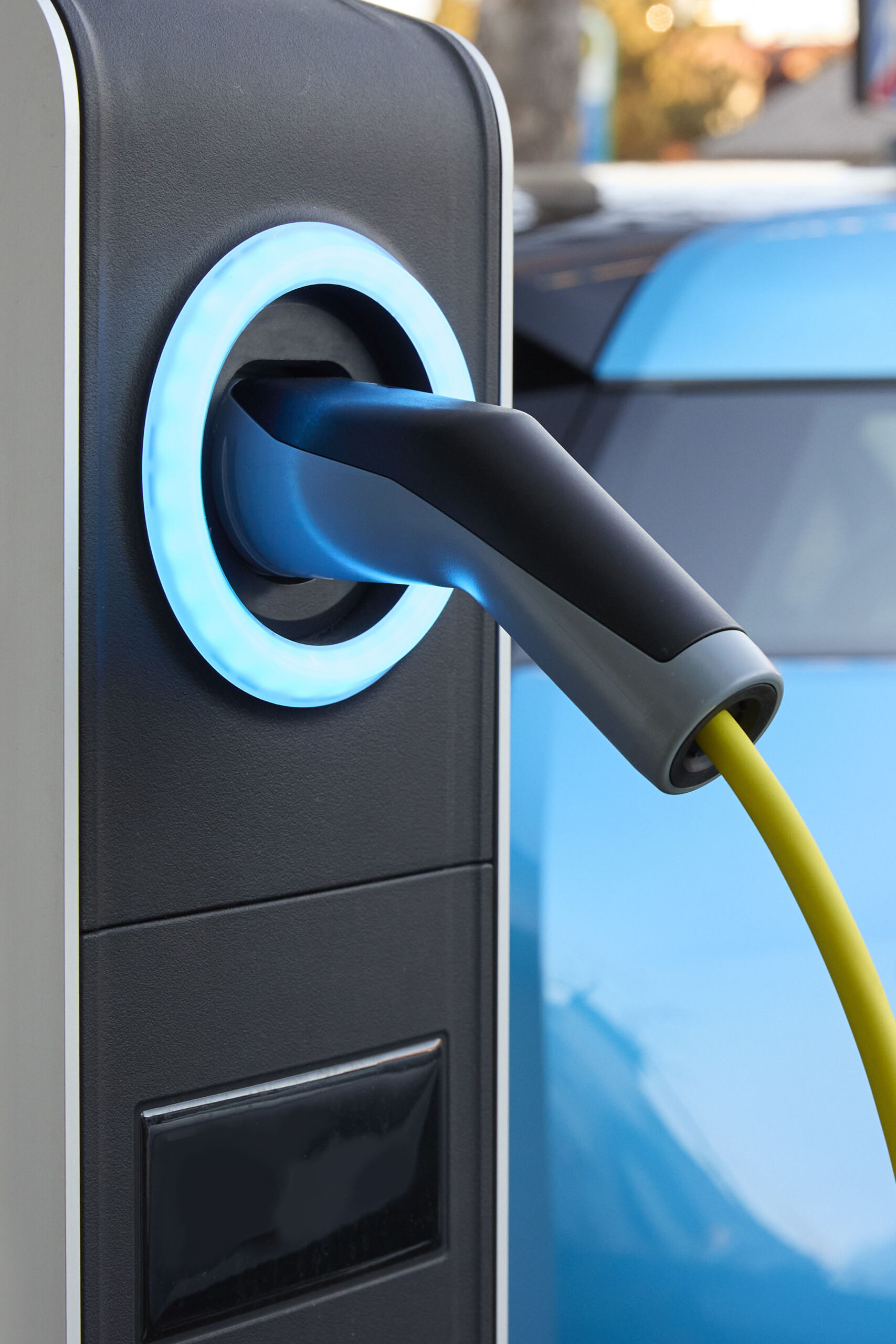 Full frame daylight image with focus of a plug-in electric vehicle charging station in Germany